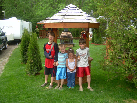 Posing by seasonal camper's well